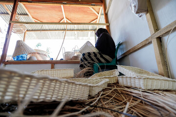 traditional market with goods made from rattan, bamboo and palm leaves.