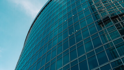 mirrored windows of the facade of an office building