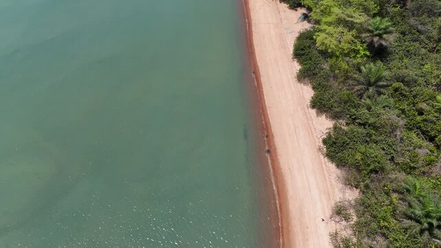 Drone flying above Pink Sand Beach in Bijag&oacute;s Islands, Guinea-Bissau, revealing pristine coastline, exotic landscapes and tranquil natural beauty
