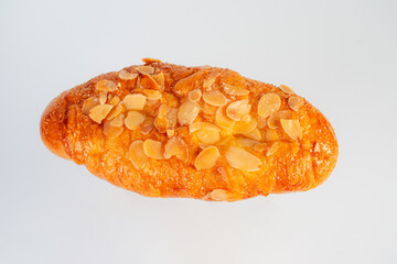 Fresh Rose Croissant with Almonds on White Background