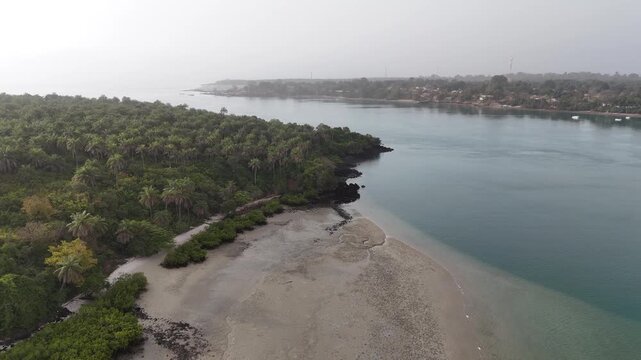 Golden light over tropical mangroves and calm ocean waters in the Bijag&oacute;s Archipelago, Guinea-Bissau Africa drone footage