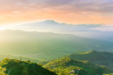 highland mountain landscape of beautiful sunset or sunrise with nice mountain peaks and slopes,...