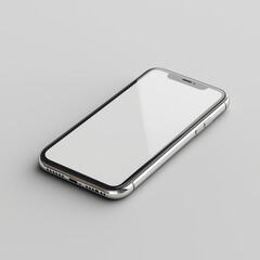 A silver smartphone with a blank white screen lying on a light gray surface in a studio setting