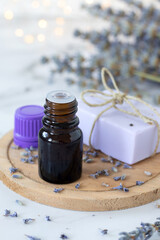 Lavender flower with essential oil in bottle and soap. Skin health, wellness, and aromatherapy concept. 