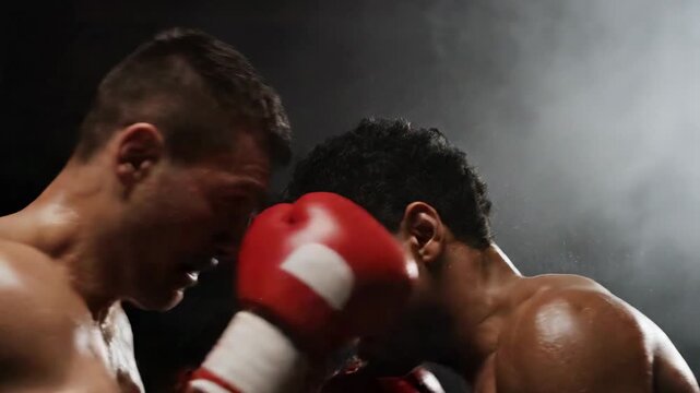 Boxers in intense action during a boxing match