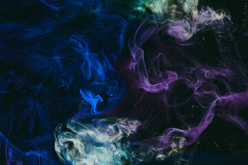 Abstract colorful background. Moving flow of blue purple paints, multicolored fluid liquid art