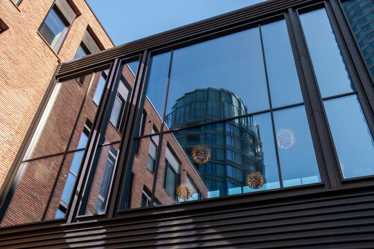Reflections of glass fa&ccedil;ades merging with modern office towers in Copenhagen creating abstract architectural patterns and corporate visual harmony
