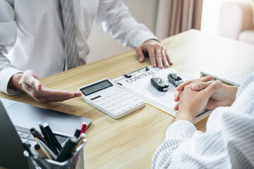 Car dealer manager presenting customer signing car document contract agreement, successful car loan contract buying or selling new vehicle and pointing document