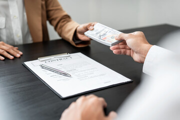 Bribe employer is offer terms to the businessman for signing on contract while making corruption about buy land and real estate