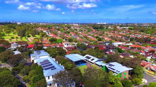 Aerial Drone view of Sydney Inner West Sydney Suburb of Ashbury and Croydon with house roof tops, the streets parks and cars in Sydney NSW Australia