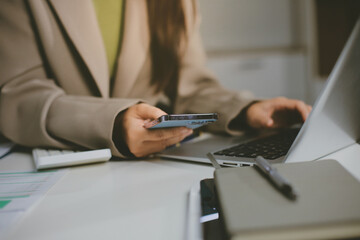 Fototapeta premium Portrait of young Hispanic professional business woman standing in office. Happy female company executive, smiling businesswoman entrepreneur corporate leader manager looking at camera using tablet