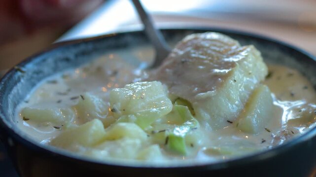 Scooping Traditional Cullen Skink Soup With a Spoon