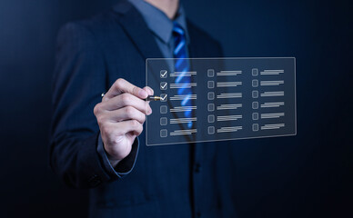 Businessman checking digital checklist on virtual screen, concept for task management, productivity, project planning, organization workflow, and quality control in modern technology.