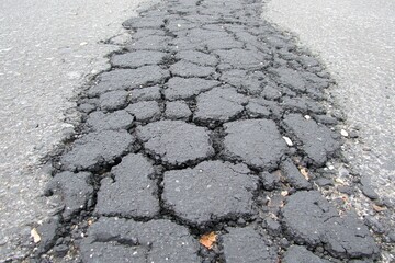 Cracked asphalt road showing degradation