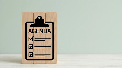 Wooden block with agenda checklist and checkboxes on a light background