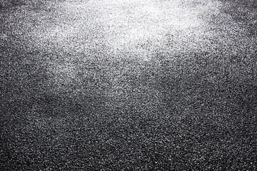 Textured gray granular surface fading to white light