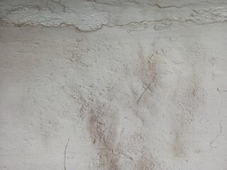 Distressed Light Wall Surface with Flaking Paint and Stain