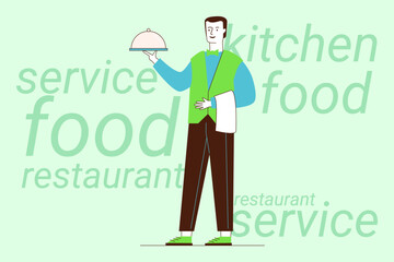 Waiter standing in restaurant, holding covered dish. He wearing green vest and showing friendly demeanor. Food-related text in background