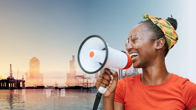 Happy black woman with megaphone