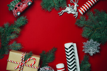 Christmas composition with gifts on a red background.