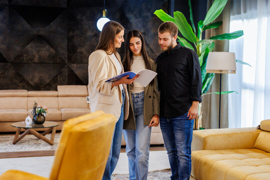 Real estate agent showing potential apartment to couple