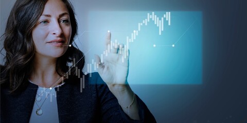 Senior businesswoman pointing on futuristic digital presentation