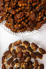 An elegant assortment of fresh dates filled with almonds and walnuts. A classic Middle Eastern treat for festive dessert tables, weddings, and celebrations.