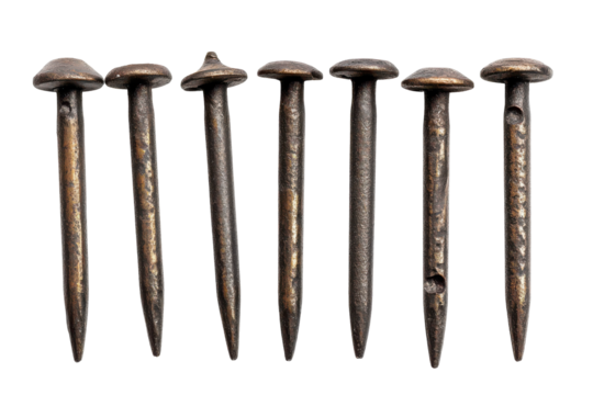 Seven antique rusted iron nails isolated on transparent background. Set of metal nail heads isolated on white background.