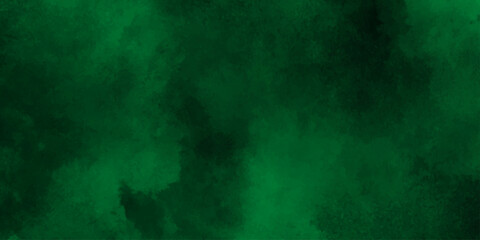 Deep emerald watercolor splash forming a vibrant and textured green abstract background,Dark green watercolor. Emerald green color. Vivid textured aquarelle painted art design background.
