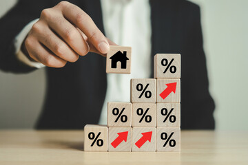 Real estate market growth concept with house icon on wooden block and percentage increase chart trend