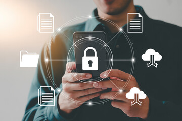 Mobile data security and protection concept man using smartphone with padlock and cloud icons around it