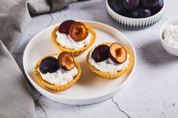 Mini baking with ricotta and berries on a plate on the table
