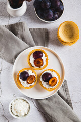 Mini baking with ricotta and berries on a plate on the table top and vertical view