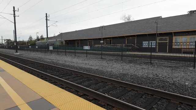 Gimbal wide panning shot of the Caltrain station in Santa Clara, California. 4K