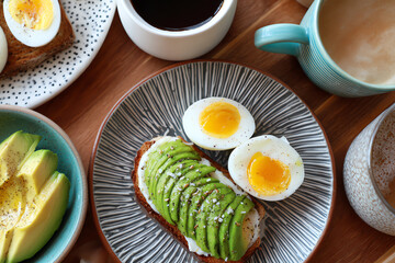 Breakfast Spread: Delightful arrangement of sliced avocado toast, boiled egg, and coffee. A culinary moment captured in a delightful composition, featuring the beauty of fresh.