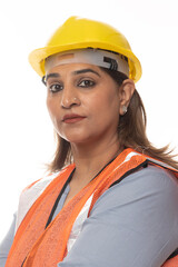 Close shot of confident Indian engineer woman wearing protective helmet and vest working while isolated on white background