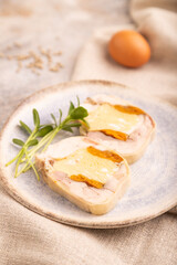 Chicken, egg and dried apricot meatloaf on brown concrete. Diet, healthy eating. side view, selective focus