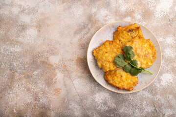 Fried crispy Chicken pancakes on brown concrete. top view, flat lay, copy space
