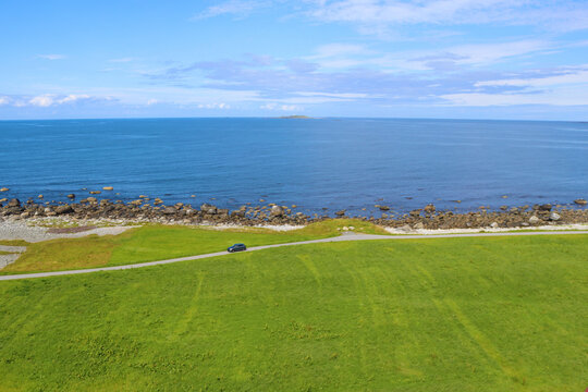 View of the Atlantic Ocean and coastline from Alnes lighthouse, Alnes island, Norway