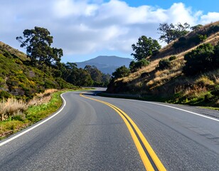 Winding road through a valley on a sunny day