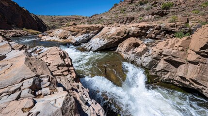 Natural Waterfall Wonders: Flowing Streams, Forested Mountains, and Moss-Covered Rocks in Outdoor Landscapes