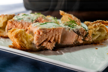 Puff pastry and salmon roll. Baked salmon in dough. Diet. Food concept