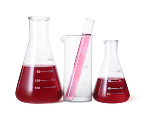 Different laboratory glassware with red liquid isolated on white