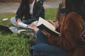 Happy students walking together on university campus, chatting and laughing outdoors after classes