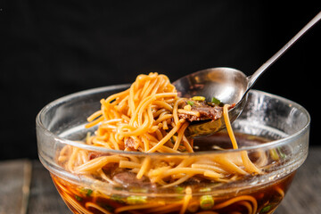 Spaghetti with beef in a glass bowl. Pasta. Food concept.