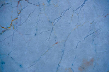 Elegant blue marble texture with intricate veining, creating a sophisticated and luxurious surface for design projects and artistic creations