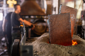 Ferrous metal billet is melted in an induction furnace closeup