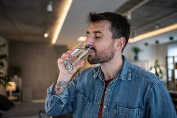 Man drinking fresh water for hydration and refreshment