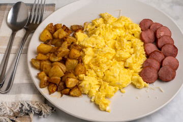 scramble eggs  with kielbasa and home fries