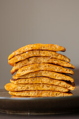 stack of pumpkin spice pancakes with a slice showing the fluffy texture